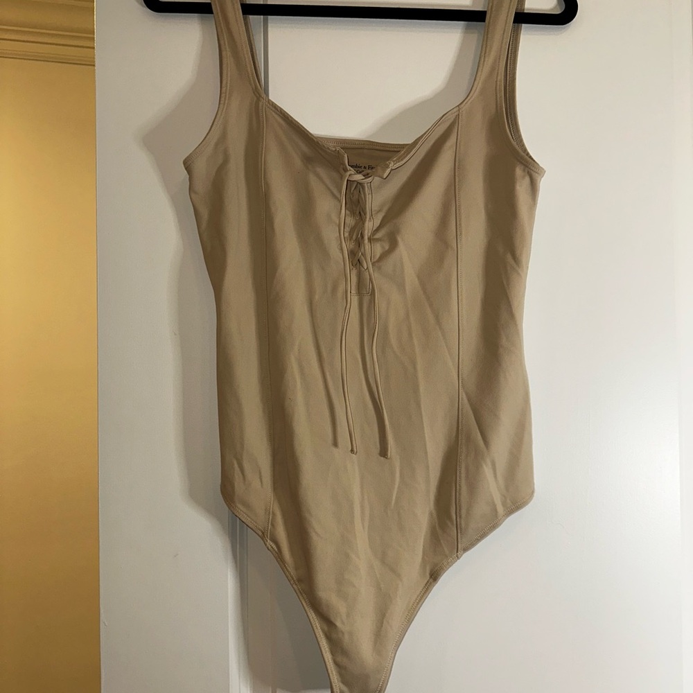Abercrombie & Fitch Tan Bodysuit with Sleeveless Design and Low-Cut Neckline